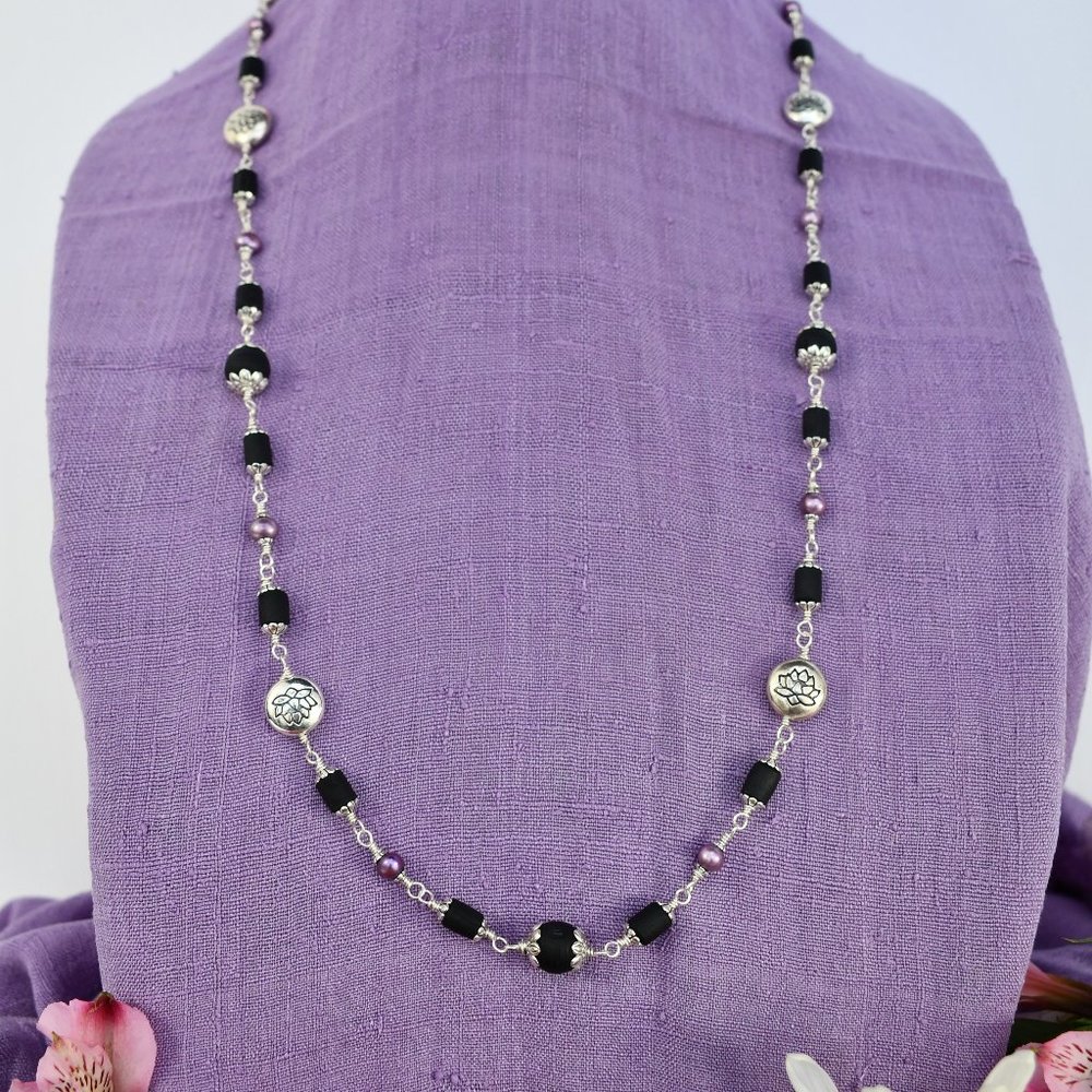 32  3/4" black Tulasi with silver lotus beads and purple pearls